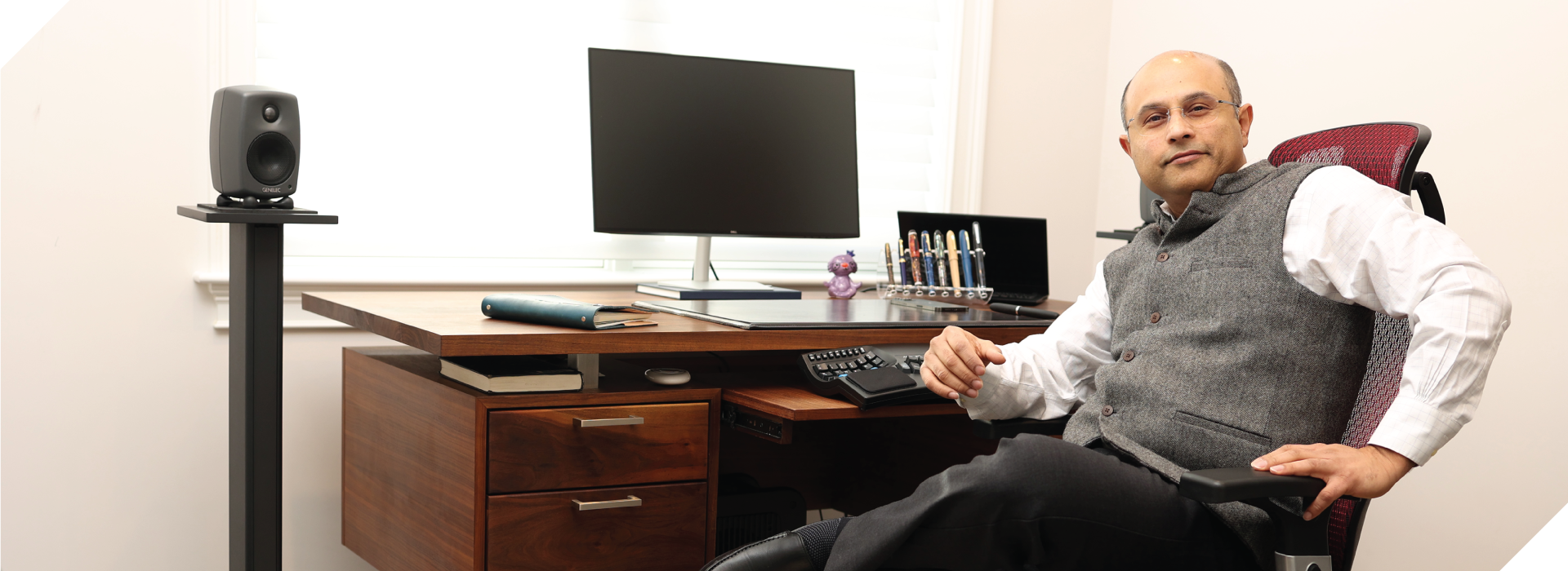 Registered & certified financial advisor Vikram Kaul working in his office.