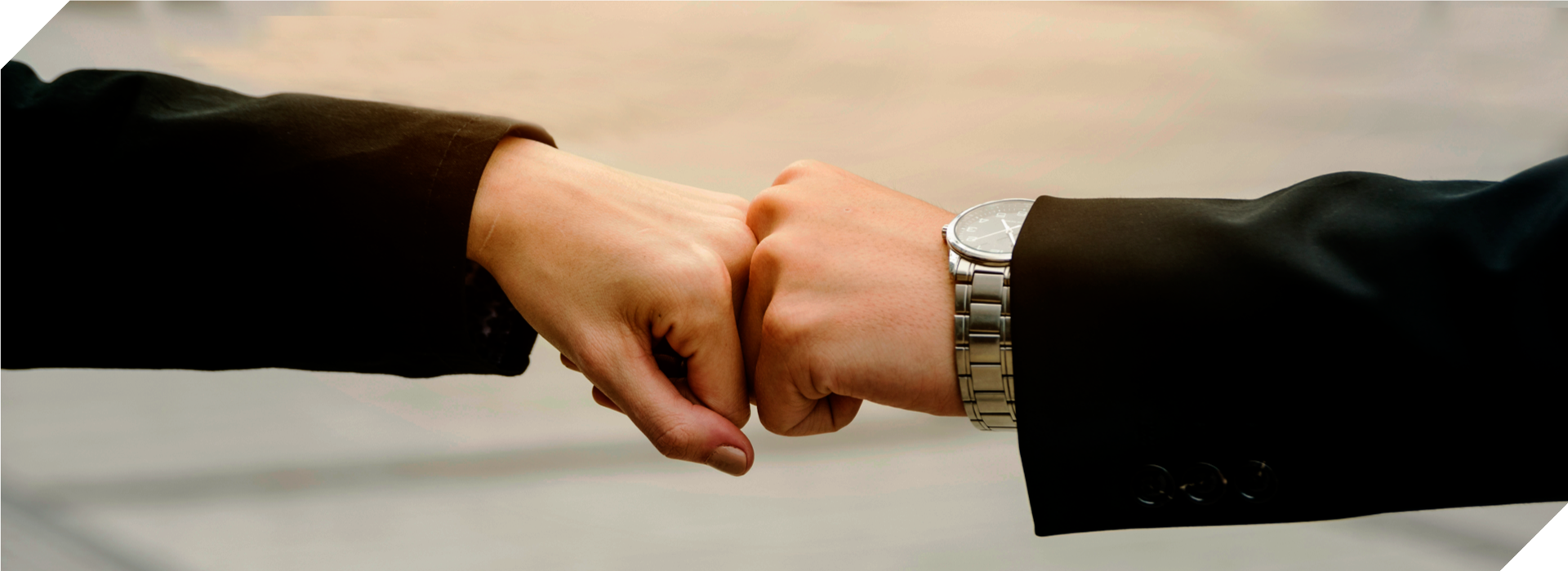 Financial advisor Vikram Kaul & his client bumped hands together after connecting for a financial planning meeting.